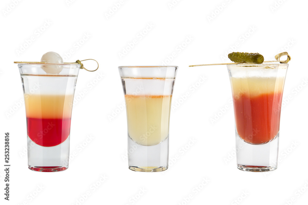 Popular alcohol shots on a white background. Three shots. Popular alcohol shots on a white background. Three shots.