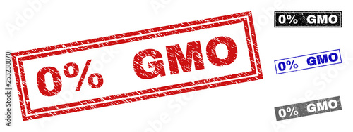 Grunge 0% GMO rectangle stamp seals isolated on a white background. Rectangular seals with distress texture in red, blue, black and grey colors.