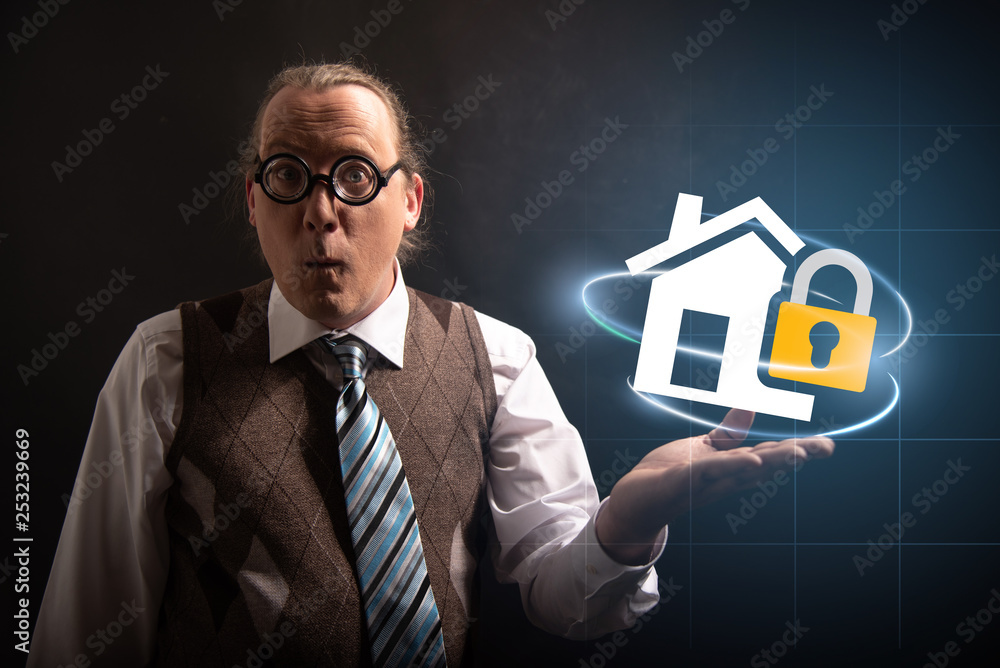 Funny nerd or geek looking to camera with home insurance icon having an idea Funny nerd or geek looking to camera with home insurance icon having an idea