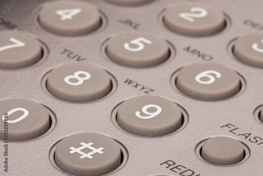 A close up of a Black office IP Phone on a desk Toned image A close up of a Black office IP Phone on a desk Toned image