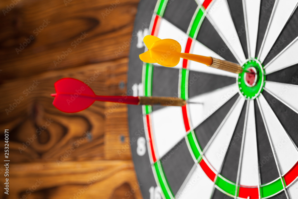 Fototapeta premium The darts on wooden background