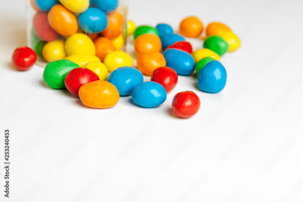 Bottles with sweet candies on table