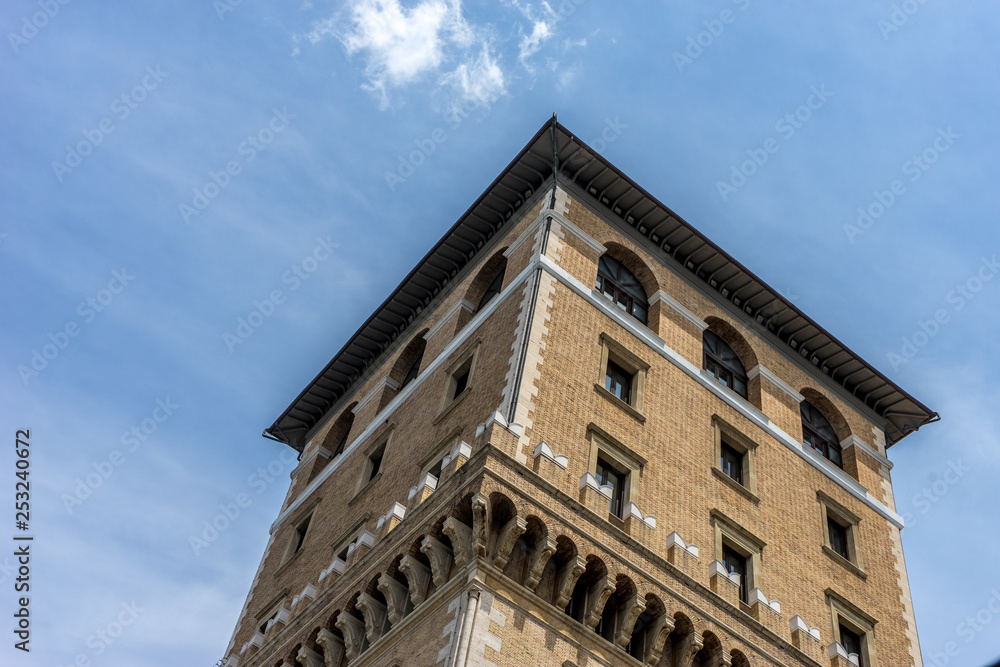 Italy, Rome, Roman Forum, a large brick tower with a clock on the side of a building