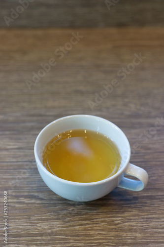 Hot tea on wood table.
