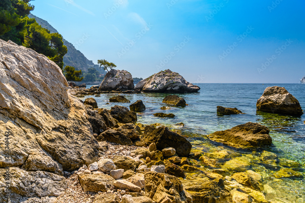 Sea beach with stones and rocks, Beausoleil, Nice, Nizza, Alpes-Maritimes, Provence-Alpes-Cote d'Azur, Cote d'Azur, French Riviera, France Sea beach with stones and rocks, Beausoleil, Nice, Nizza, Alpes-Maritimes, Provence-Alpes-Cote d'Azur, Cote d'Azur, French Riviera, France