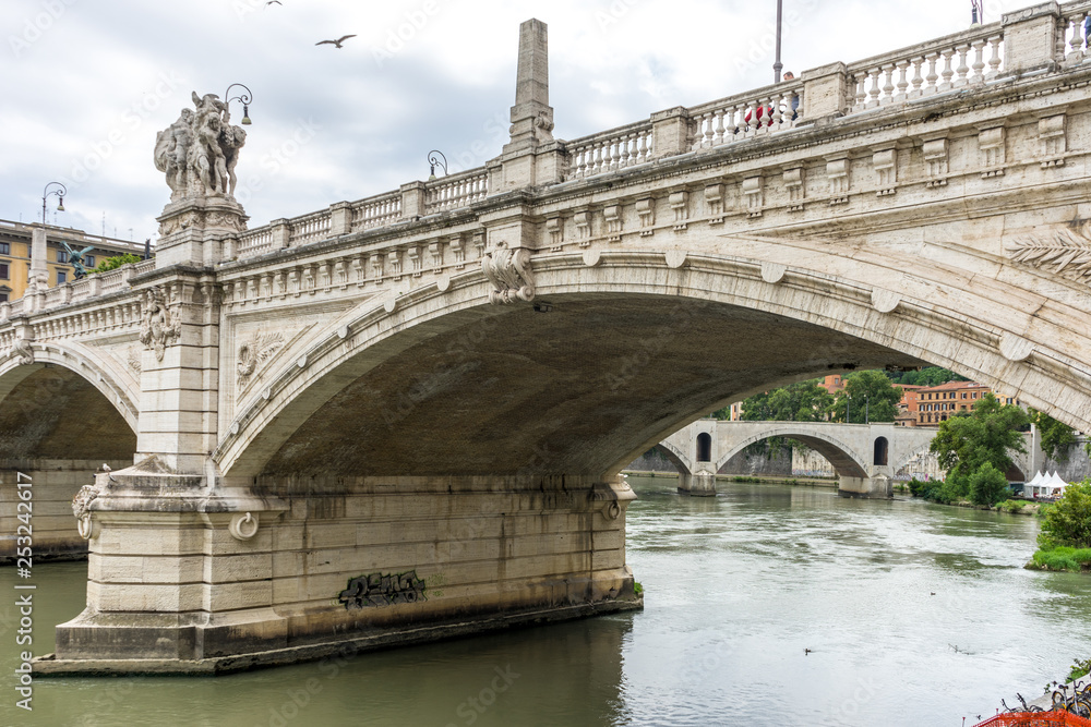 Italy, Rome, a close up of the base of a bridge on tiber river