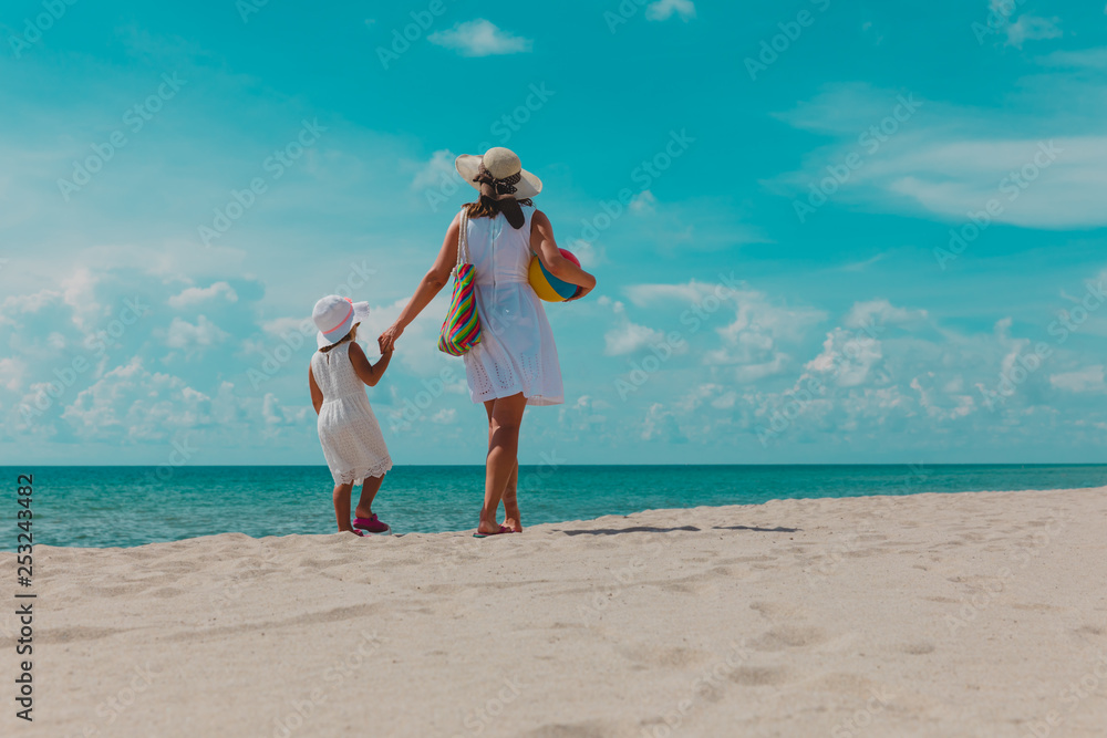 mother with little daughter walk on beach mother with little daughter walk on beach