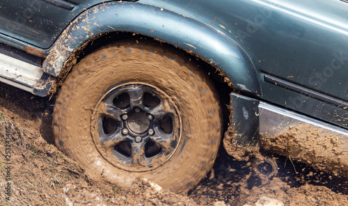 Car wheel slips in the dirt in nature © schankz