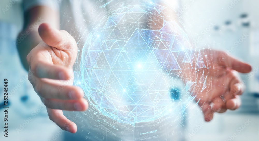 Businessman using digital triangle exploding sphere hologram 3D rendering Businessman using digital triangle exploding sphere hologram 3D rendering