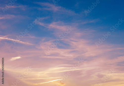 Cloudscape. Beautiful sky. Colorful dramatic sky with clouds at sunset. Bright blue  pink  orange and yellow colors of sunset   sunrise. Sunset abstract 