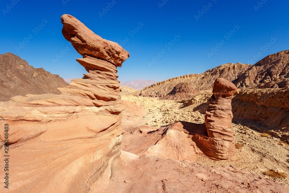 mushroom shaped stone in a desert near Amraam pillars in Israel mushroom shaped stone in a desert near Amraam pillars in Israel