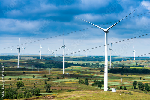 Wind turbine against mountain