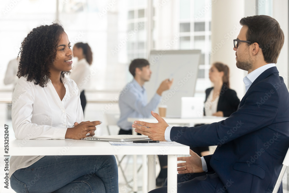 Multiracial businesspeople working together in shared office Multiracial businesspeople working together in shared office