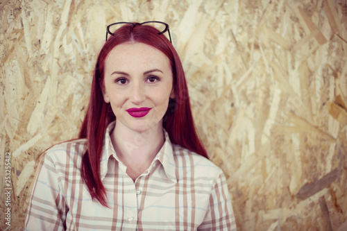 portrait of young redhead business woman