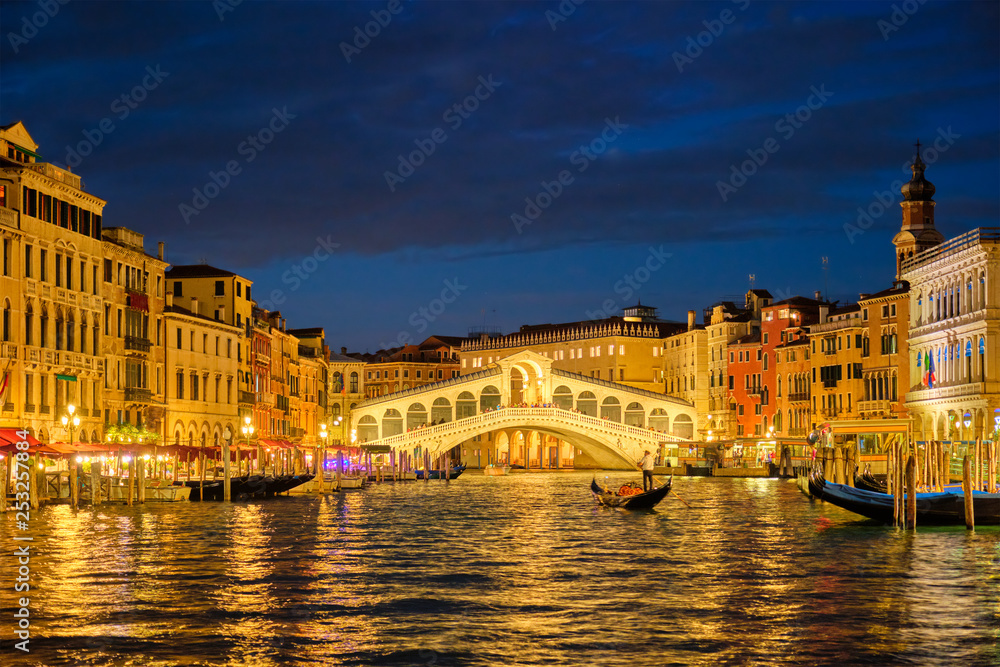  Rialto bridge Ponte di Rialto over Grand Canal at night in Venice, Italy