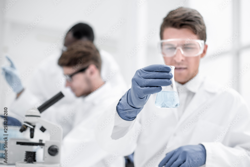 group of young scientists conduct laboratory studies group of young scientists conduct laboratory studies