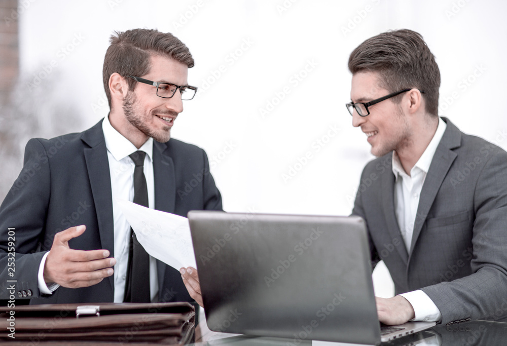 close up.two business men discussing a business document close up.two business men discussing a business document