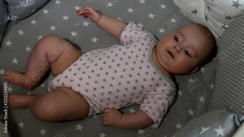 Newborn baby. Little baby. Child. Adorable baby girl. Baby in crib. Baby in bed