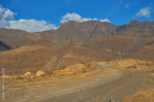Mountain road from Khasab to Dibba on the background of a beautiful landscape. Musandam Peninsula. Oman