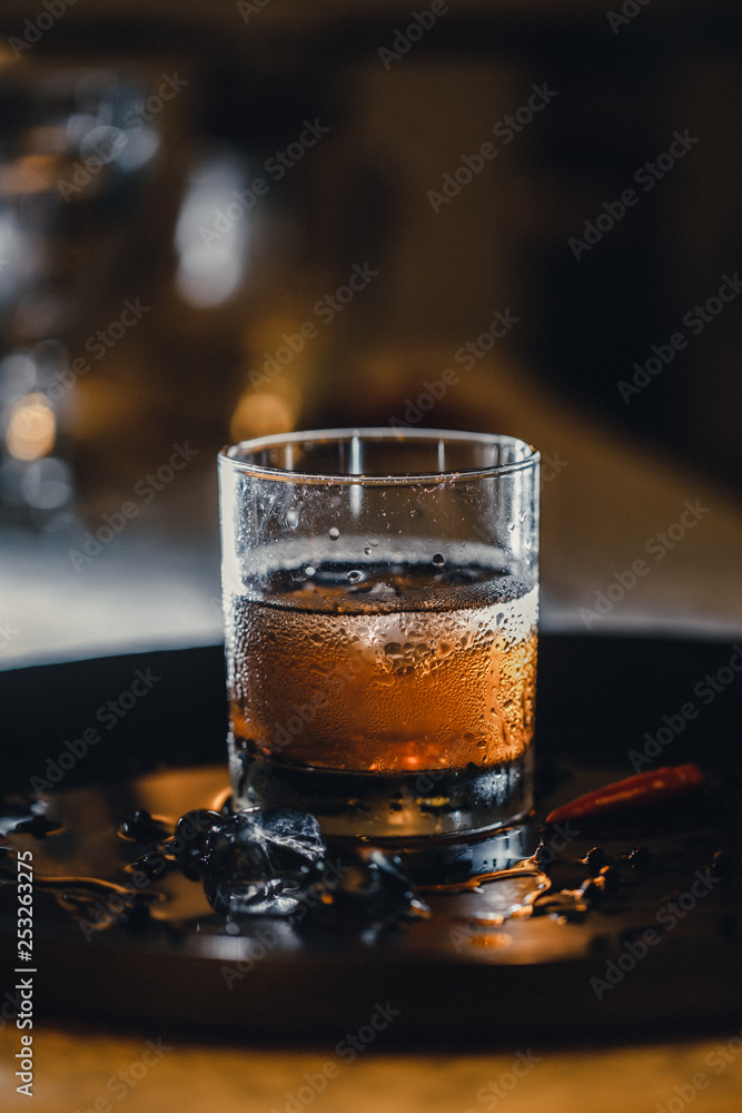 Refreshing soft drink. Cola and ice in the glass. Water droplets on the glass. Refreshing soft drink. Cola and ice in the glass. Water droplets on the glass.