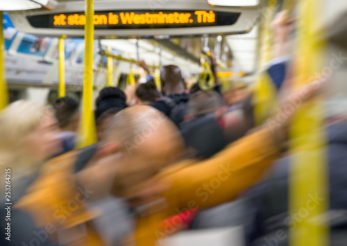 Photography Crowded subway train in London with blurred motion of passengers during rush hou