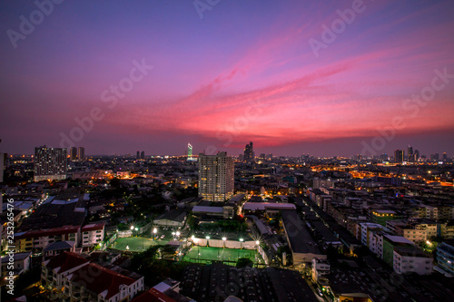 The background of the high angle view in the evening  overlooking the condominium that is under construction in a variety of heights  showing the habitat of the capital city.