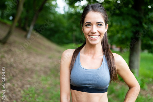 Portrait of athletic woman resting after running in nature