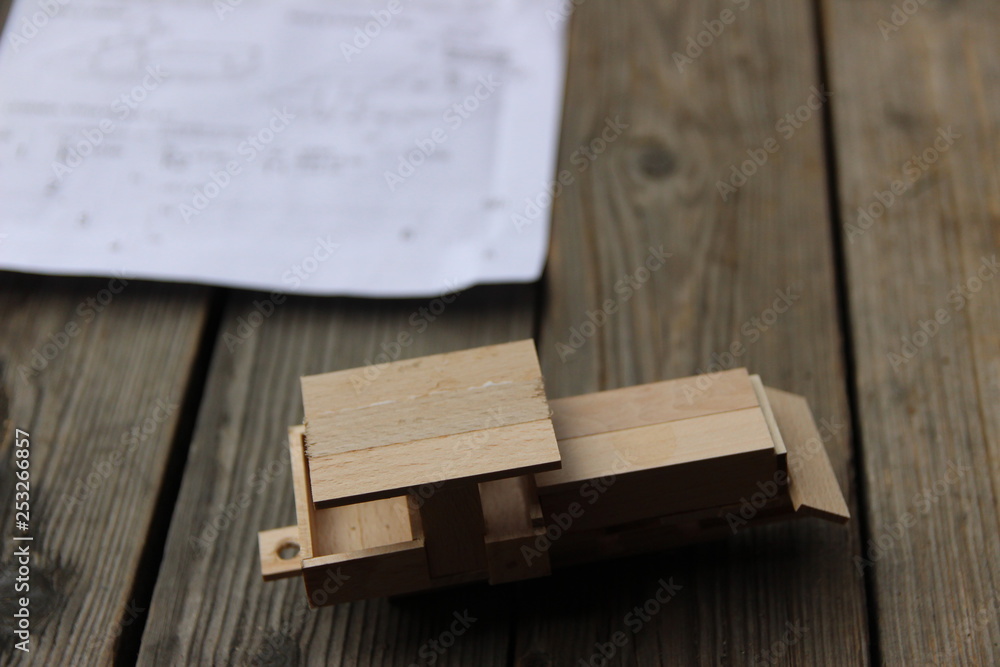 Child's hand, fold and stick a wooden toy Child's hand, fold and stick a wooden toy