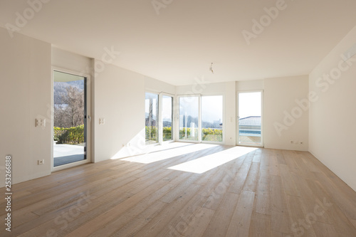 Empty white living room interior with parquet