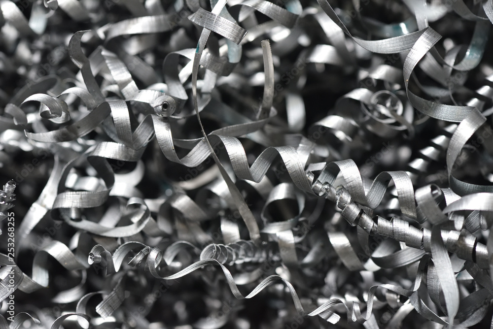 A lot of metal shavings close-up, after working on a milling machine or CNC machine. Texture metal shavings macro A lot of metal shavings close-up, after working on a milling machine or CNC machine. Texture metal shavings macro