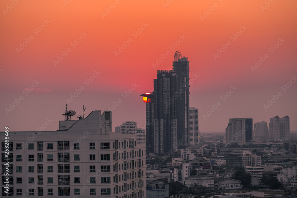 The background of the high angle view in the evening, overlooking the condominium that is under construction in a variety of heights, showing the habitat of the capital city. The background of the high angle view in the evening, overlooking the condominium that is under construction in a variety of heights, showing the habitat of the capital city.