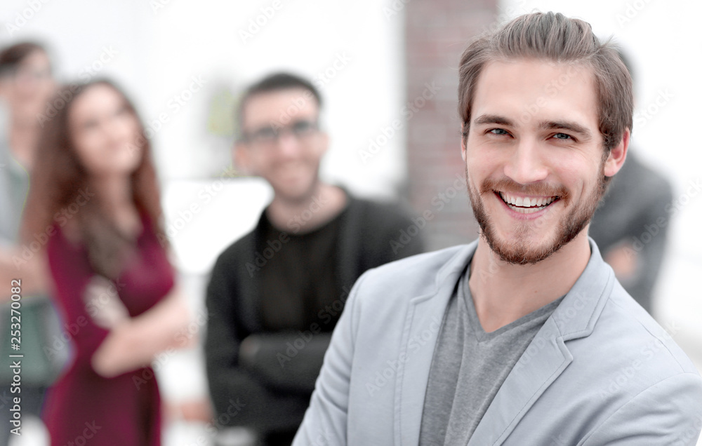 successful designer in the background of his team successful designer in the background of his team