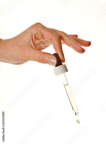 Vászonkép Hand with eyedropper