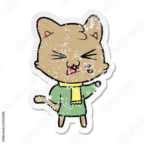 distressed sticker of a cartoon hissing cat