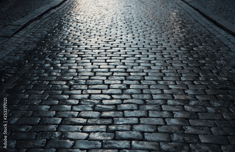 dark cobblestone road