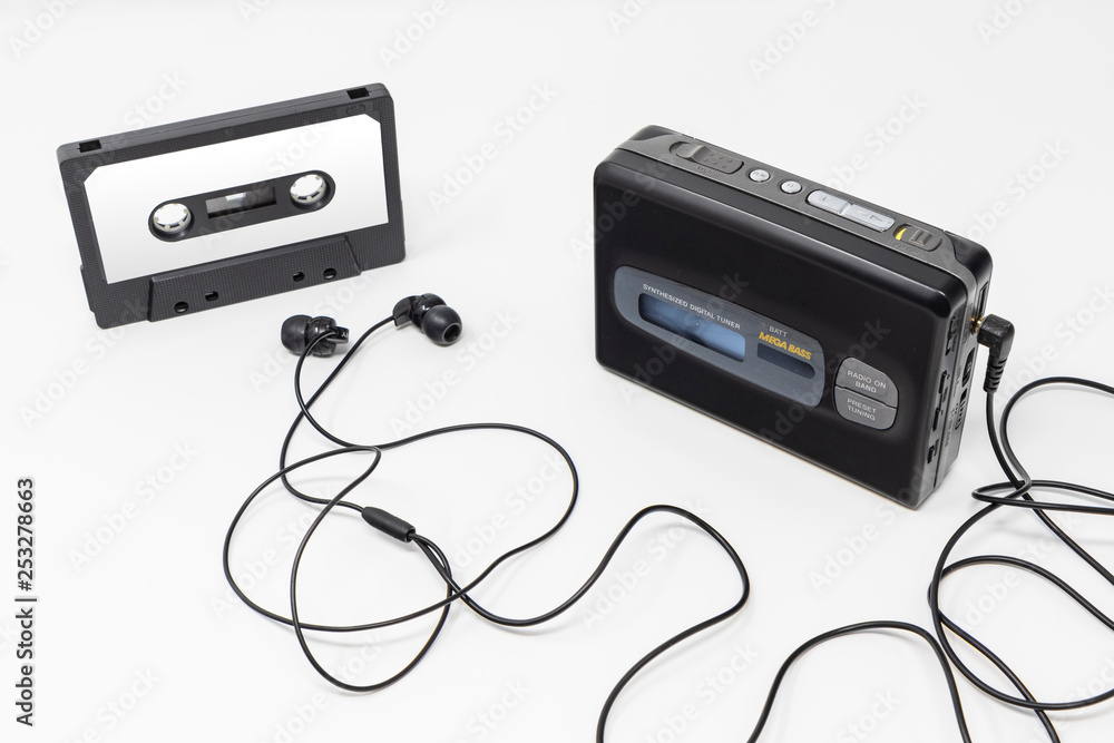 Vintage audio player. Old fashioned portable cassette player, cult object,  icon and symbol of the 80s and 90s. Blank audio tape and headphones  isolated on white background. Stock Photo | Adobe Stock