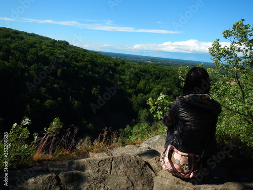 Rear view of young woman enjoying the view in Söderåsen NP, Sweden