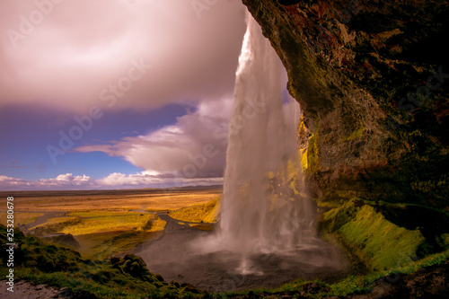 Fototapeta Naklejka Na Ścianę i Meble -  View of a waterfall in Iceland. Water flows from top to bottom.