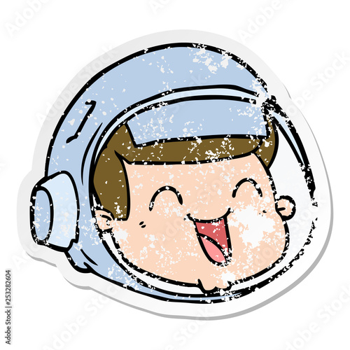 distressed sticker of a cartoon happy astronaut face