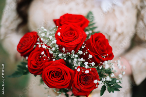 Bride holds a wedding bouquet  wedding details