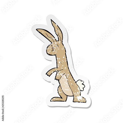 retro distressed sticker of a cartoon rabbit