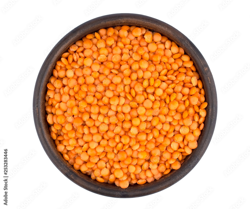 Red lentils in plate isolated on white background Red lentils in plate isolated on white background