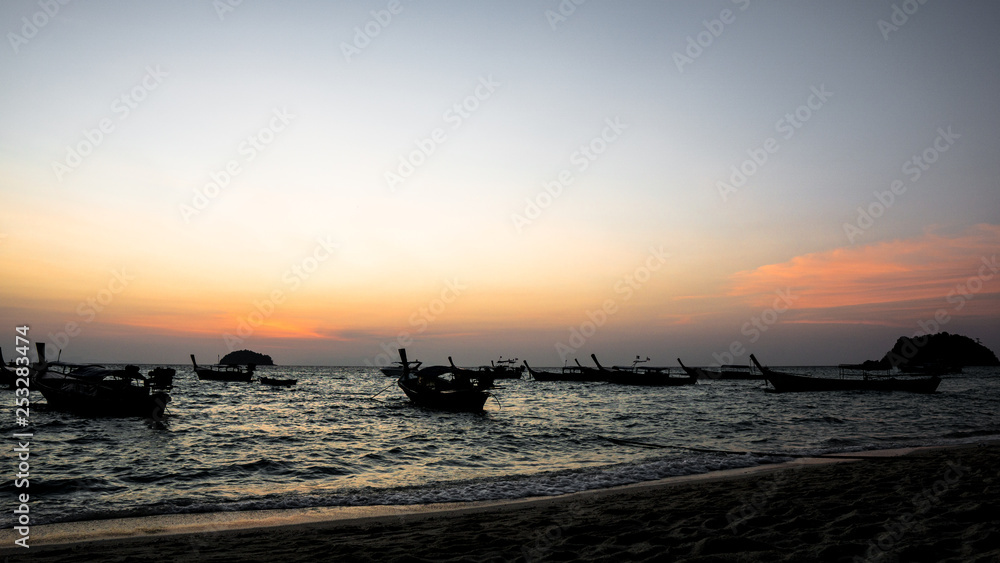 sunrise on sea and fishing boats