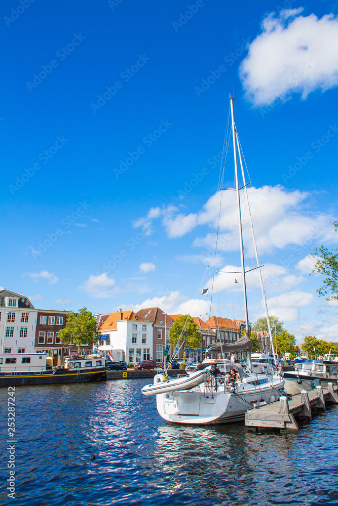 A view of the canal, houses and boats in Haarlem, the Netherlands