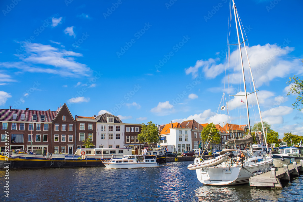 A view of the canal, houses and boats in Haarlem, the Netherlands