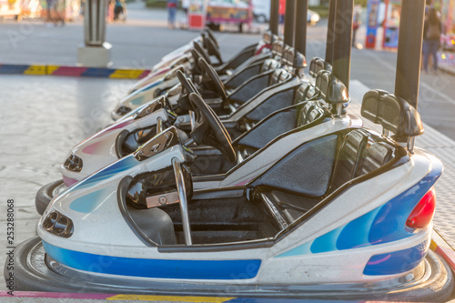 Bumper cars at a fair, lined up and ready