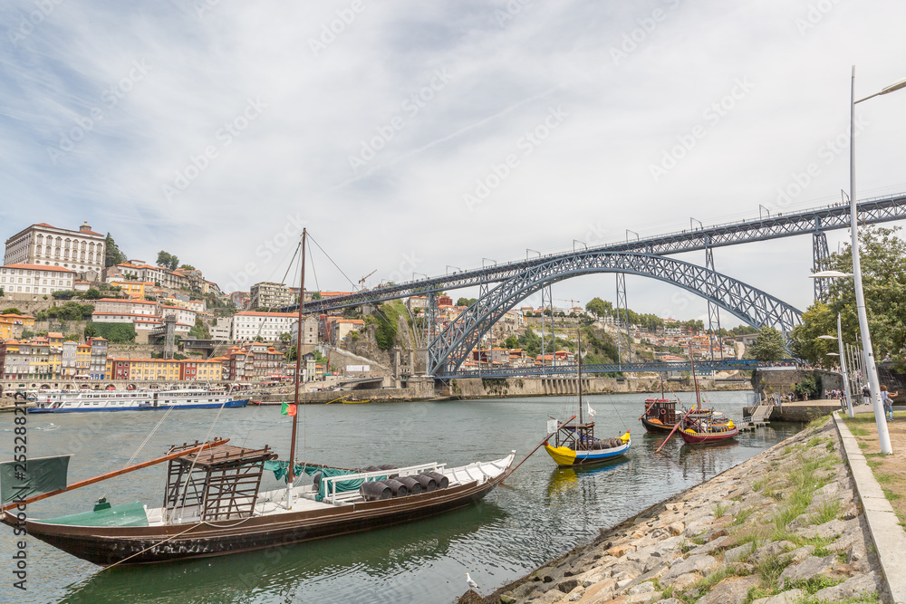 Rabelos with port wine barrels on the Rio Douro in front of the Ponte Luís I in Porto