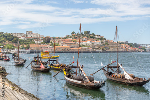 Typical portuguese wooden boats, called -barcos rabelos- used in the past to transport the famous port wine towards the cellars of the city © Óscar