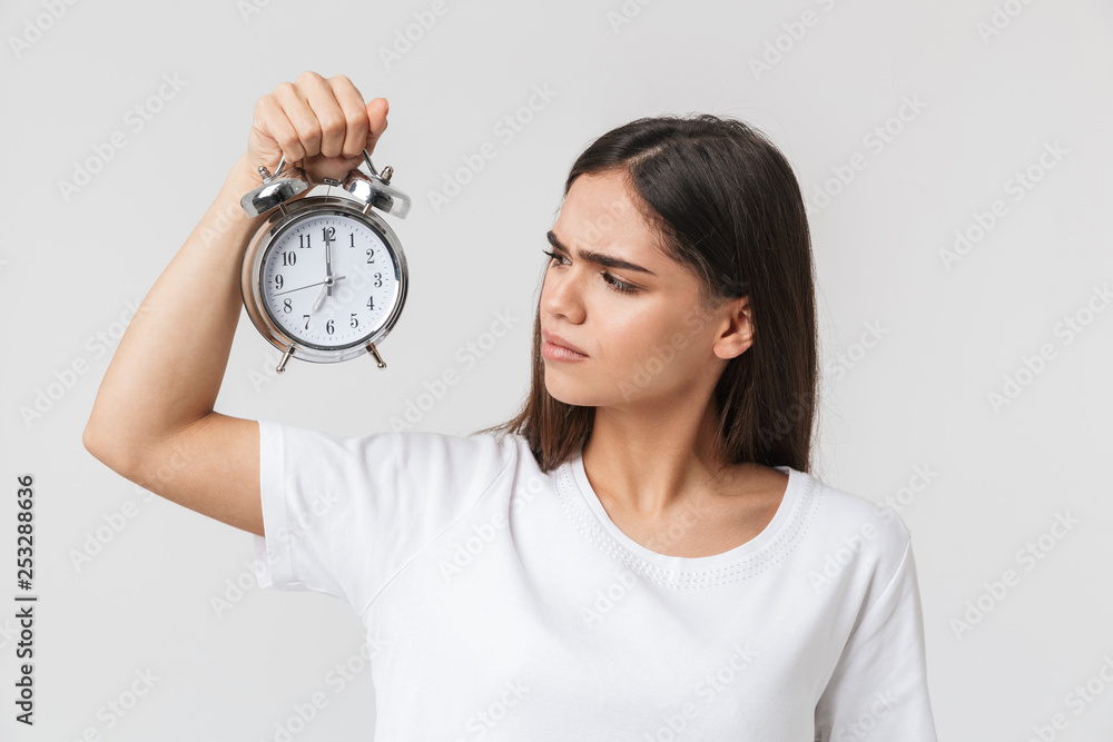 Angry young girl standing isolated over white Angry young girl standing isolated over white