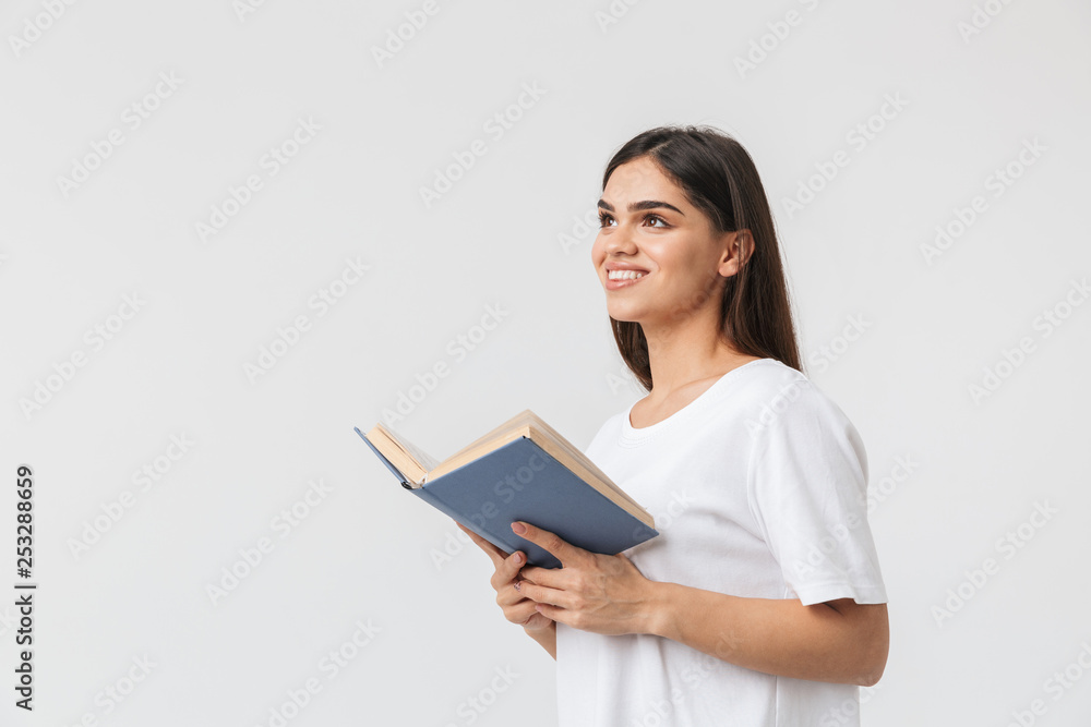 Happy young girl standing isolated